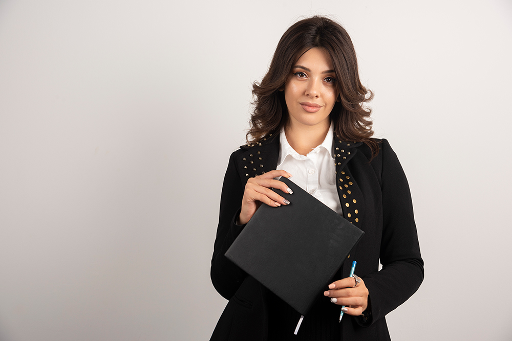 pretty-teacher-posing-with-book-white